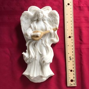 Cast marble angel wall hanging